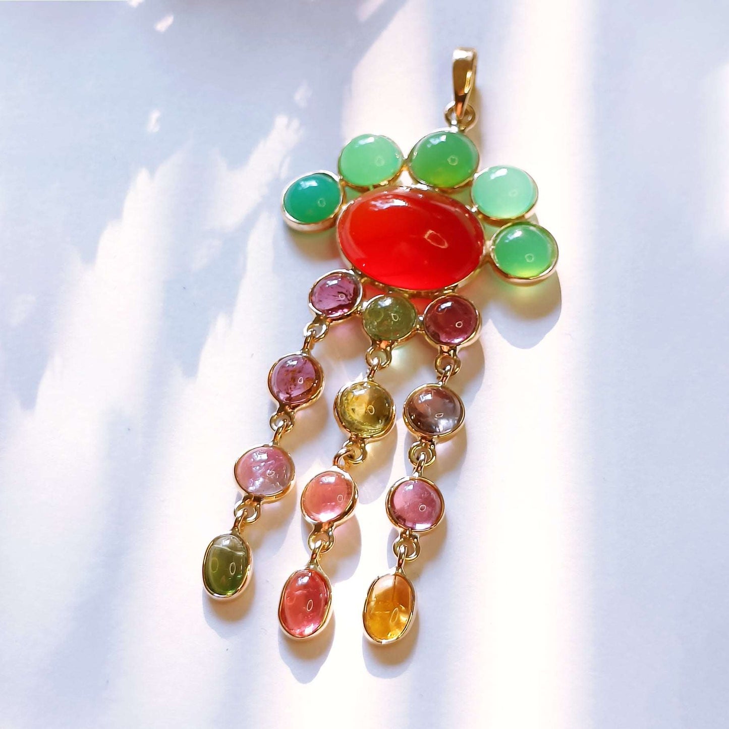Rain of Autumn Pendant – displayed on warm-toned fabric
